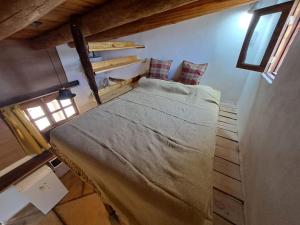 Una cama o camas en una habitación de La Mungana