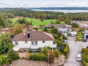 an aerial view of a white house with a driveway at 8 person holiday home in Lysekil-By Traum in Lysekil