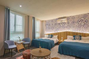 Postel nebo postele na pokoji v ubytování Ashare Hotel