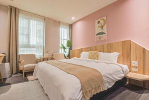 Postel nebo postele na pokoji v ubytování Ashare Hotel
