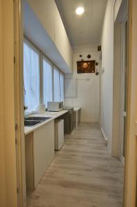 a kitchen with a sink and a counter top at Cuore di Bologna Suites in Bologna