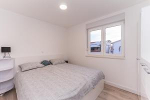 Łóżko lub łóżka w pokoju w obiekcie Apartment Losacker