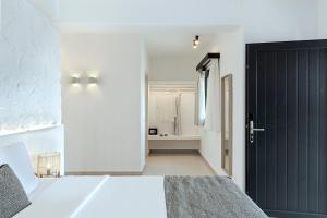 Ένα ή περισσότερα κρεβάτια σε δωμάτιο στο Onyx Hotel & Suites