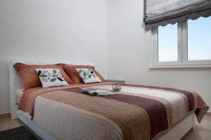 Postel nebo postele na pokoji v ubytování Apartments Vista