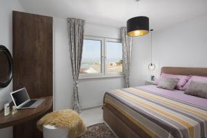 Postel nebo postele na pokoji v ubytování Apartments Vista Exclusive