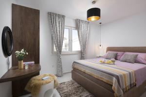 Postel nebo postele na pokoji v ubytování Apartments Vista Exclusive