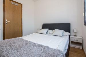 Postel nebo postele na pokoji v ubytování Apartment Wenig