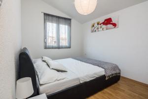 Postel nebo postele na pokoji v ubytování Apartment Wenig