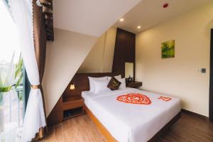 Postel nebo postele na pokoji v ubytování GREENECO DA LAT HOTEL - Khách sạn Green Eco Đà Lạt