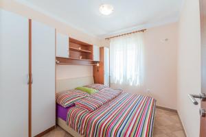 Postel nebo postele na pokoji v ubytování Apartments Hudic