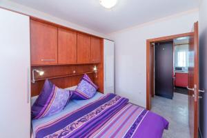 Postel nebo postele na pokoji v ubytování Apartments Hudic