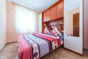 Postel nebo postele na pokoji v ubytování Apartments Hudic