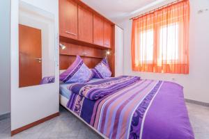 Postel nebo postele na pokoji v ubytování Apartments Hudic