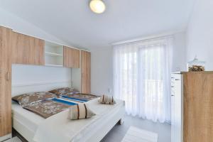 Posteľ alebo postele v izbe v ubytovaní Apartments Trk