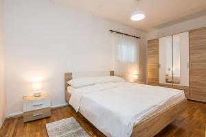 Posteľ alebo postele v izbe v ubytovaní Apartments Napros
