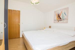 Posteľ alebo postele v izbe v ubytovaní Apartments Napros