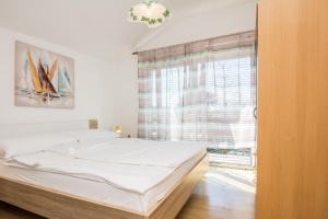 Posteľ alebo postele v izbe v ubytovaní Apartments Napros