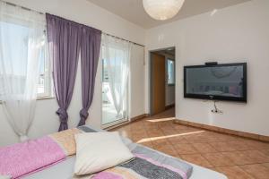 Postel nebo postele na pokoji v ubytování Apartments Bojana