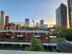 a view of a city skyline with buildings and cranes at Shared Bright and Cozy Room in Parramatta CBD - close to everything in Sydney