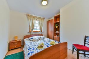 Postel nebo postele na pokoji v ubytování Apartment Druzinec