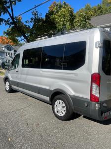 a silver van parked in a parking lot at fearlessRose Vacation Rental in Springfield
