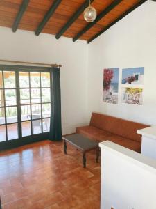 a living room with a couch and a table at Villa Elpiniki in Troulos