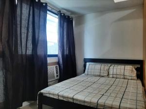 Ένα ή περισσότερα κρεβάτια σε δωμάτιο στο Family Staycation 2 with Pool