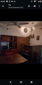 a kitchen with a table and a dining room at DEPTO FAMILIAR dolar billete dolar blue in Gualeguaychú