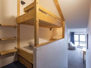 a room with a bunk bed in a house at Studio La Mongie, 1 pièce, 6 personnes - FR-1-404-342 in Bagnères-de-Bigorre