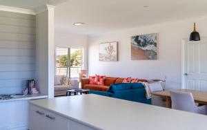 a living room with a couch and a table at Rileystone in Margaret River Town