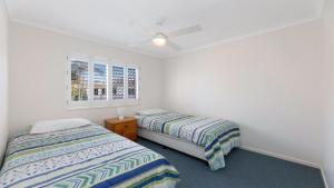 Postel nebo postele na pokoji v ubytování Kokomo Unit 10 Kings Beach QLD + 4 fotografie