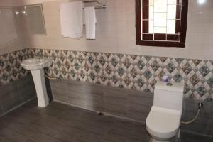 Koupelna v ubytování Green Reed Resort By Meenakshi, Kaziranga