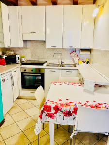 A kitchen or kitchenette at Central Apartment Private Parking Terrace & AC