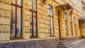 a building with a bunch of windows on it at Optima Dworzec Lviv in Lviv