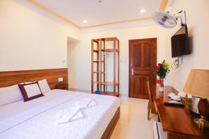 Giường trong phòng chung tại Quy Nhon Blue Sea Hotel