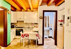 A kitchen or kitchenette at Central Apartment Private Parking Terrace & AC
