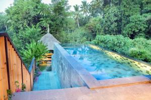 Bazén v ubytování Fivelements Retreat Bali nebo v jeho okolí
