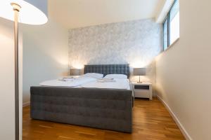 Posteľ alebo postele v izbe v ubytovaní VacationClub – Diune Apartament 202 + 11 fotografií