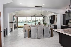 a kitchen and living room with a table and a dining room at 367 Via Lido Soud home in Newport Beach
