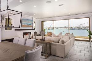 a living room with a couch and a table at 367 Via Lido Soud home in Newport Beach