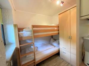 a small room with bunk beds in it at Appartement Bergrausch - 22 in Pfronten