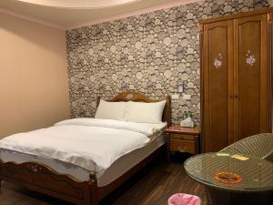 Postel nebo postele na pokoji v ubytování Niuge Minsu Homestay