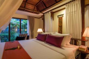 Letto o letti in una camera di Palace Residence & Villa Siem Reap