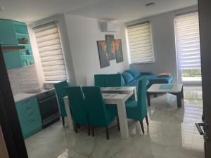 a kitchen and dining room with a table and chairs at Elite in Ostrovo
