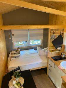 a bunk bed in a tiny house at Tiny House Ruhr im PIER9 Tiny House Hotel in Hamm