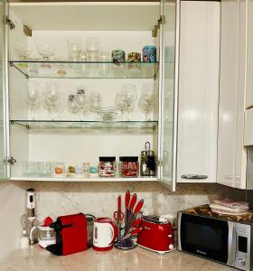 A kitchen or kitchenette at Central Apartment Private Parking Terrace & AC