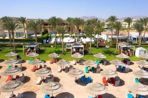 an aerial view of a beach with chairs and umbrellas at Rixos Sharm El Sheikh - Ultra All Inclusive Adults Only 18 Plus in Sharm El Sheikh