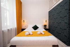 Posteľ alebo postele v izbe v ubytovaní Hive Family House
