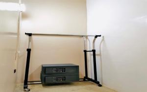 a small television sitting in the corner of a room at Big Paul Hostel in El Nido