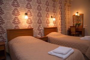 Postel nebo postele na pokoji v ubytování Hotel Liberty